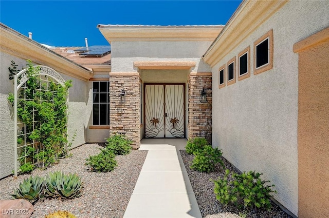 doorway to property with solar panels