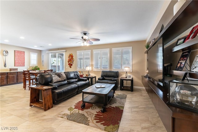 tiled living room featuring ceiling fan