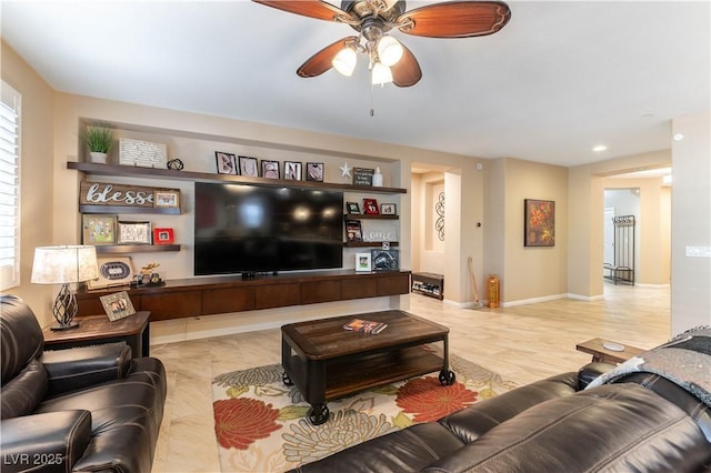 living room featuring ceiling fan