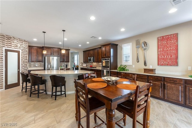 dining space featuring sink