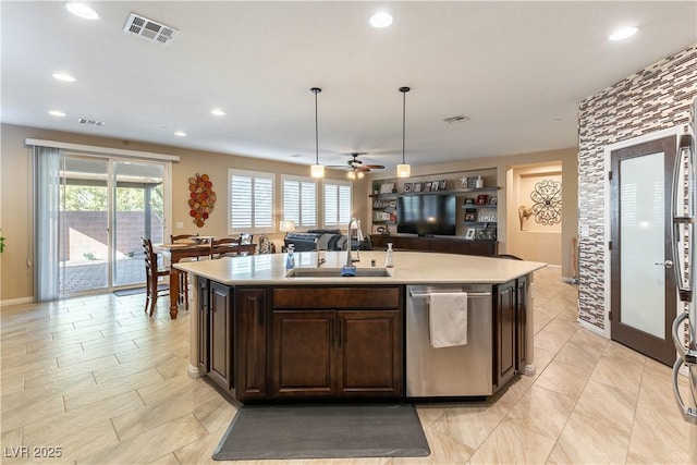 kitchen featuring dishwasher, sink, dark brown cabinets, pendant lighting, and an island with sink