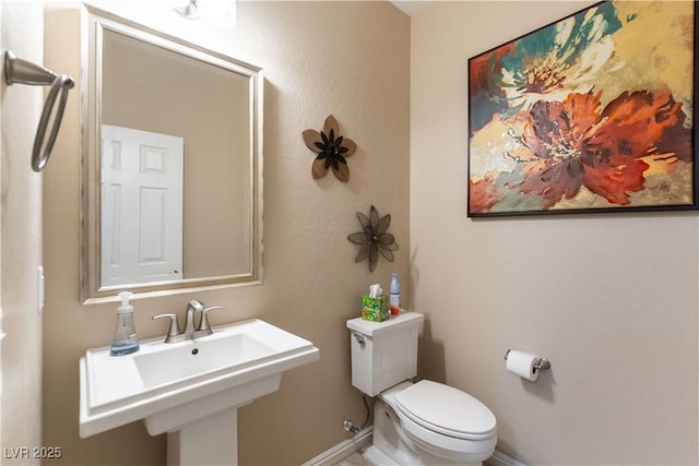 bathroom with sink and toilet