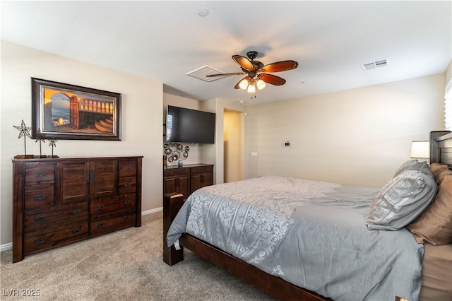 bedroom with ceiling fan and light colored carpet