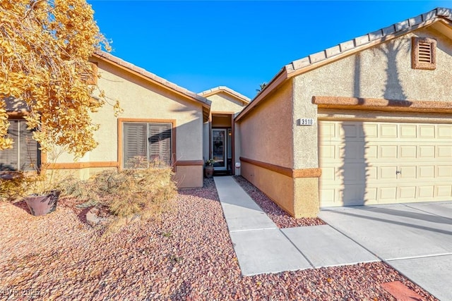 view of exterior entry featuring a garage