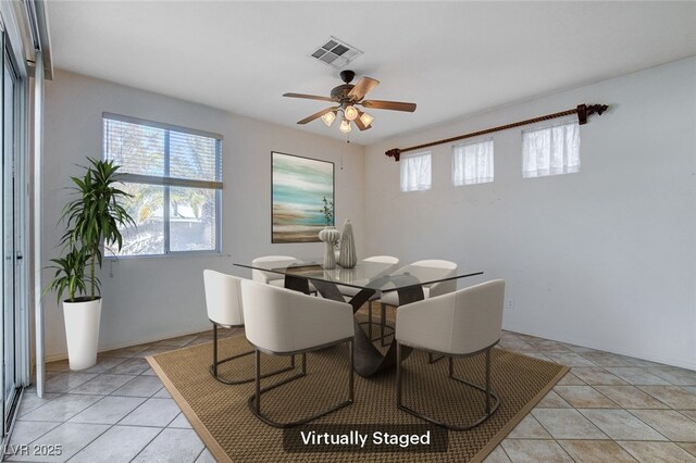 tiled dining room with ceiling fan