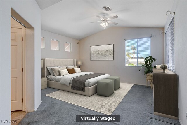 carpeted bedroom with ceiling fan and lofted ceiling