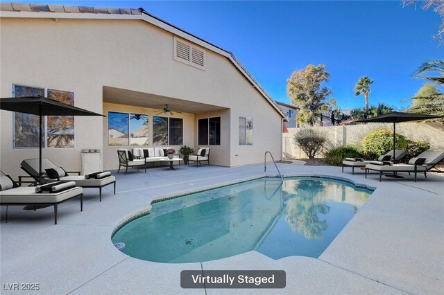 view of swimming pool with outdoor lounge area and a patio