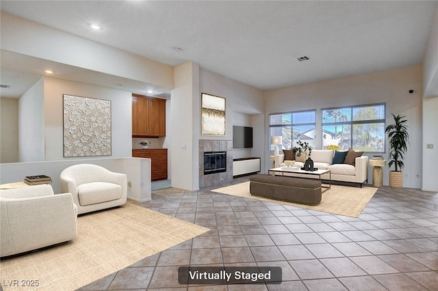 tiled living room featuring a tile fireplace