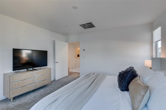 bedroom with dark colored carpet