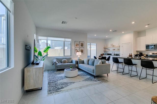 living room featuring light tile patterned floors