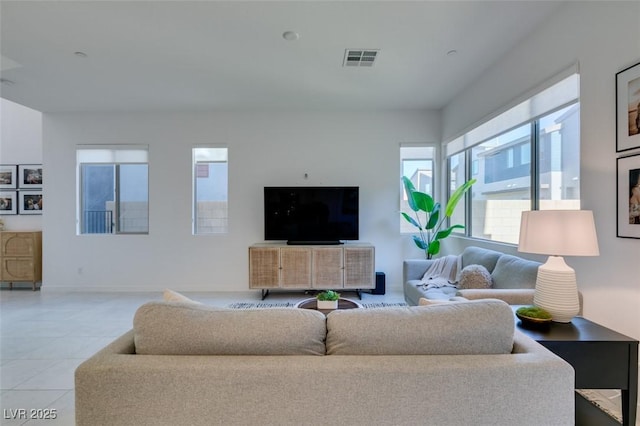 living room with light tile patterned floors