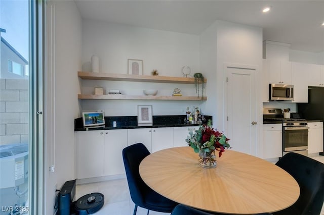 dining space featuring light tile patterned floors