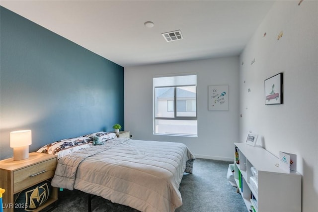 bedroom with dark colored carpet