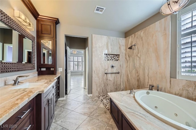 bathroom with tile patterned floors, vanity, and plus walk in shower