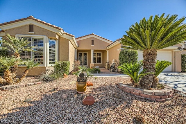 view of front of property with a garage