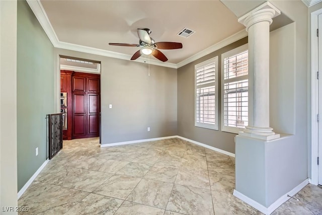 spare room featuring ornamental molding, ceiling fan, and ornate columns