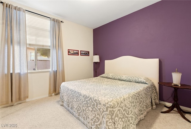 bedroom featuring light carpet