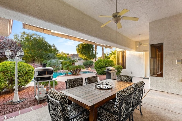 view of patio / terrace with ceiling fan and a grill