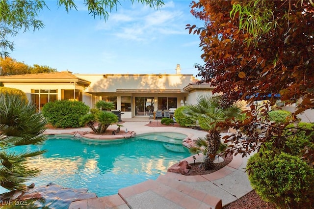 view of swimming pool featuring a patio area