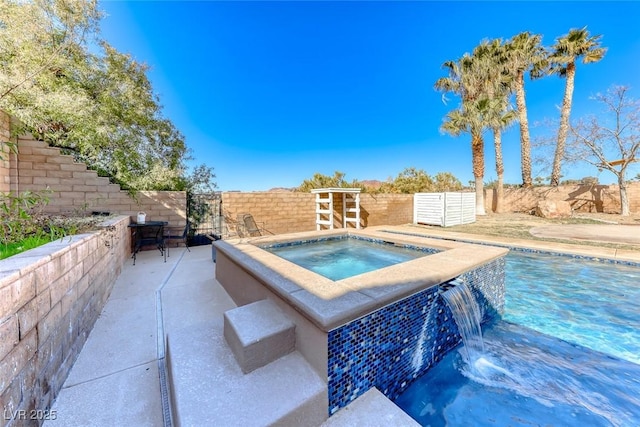 view of pool with an in ground hot tub and pool water feature