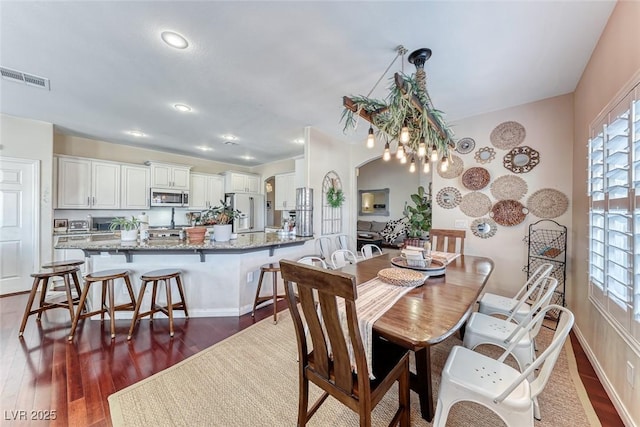 dining room with dark wood-type flooring