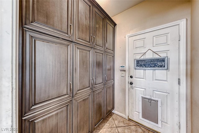 doorway featuring light tile patterned floors