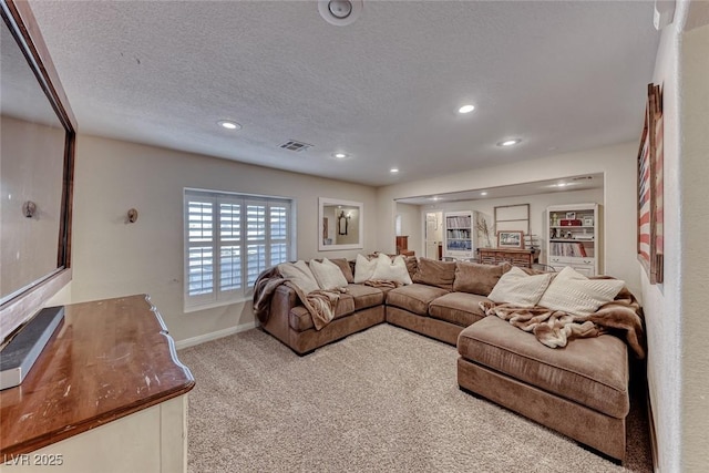 carpeted living room with a textured ceiling