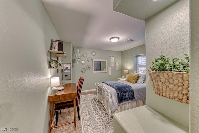 bedroom featuring light carpet