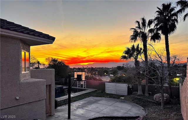 view of patio terrace at dusk