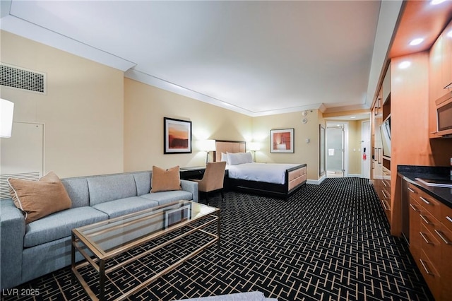 carpeted bedroom featuring crown molding