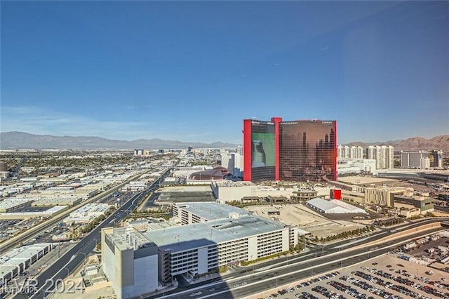 property's view of city featuring a mountain view