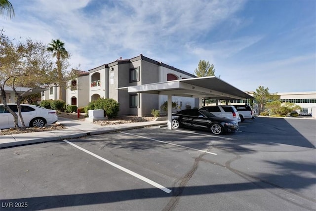 view of car parking featuring a carport