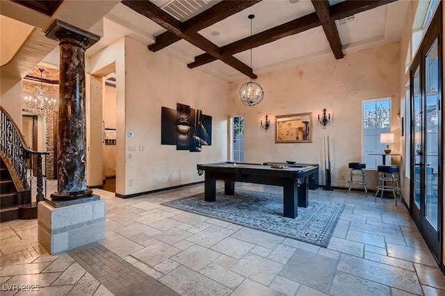 game room featuring decorative columns, coffered ceiling, a chandelier, and beam ceiling