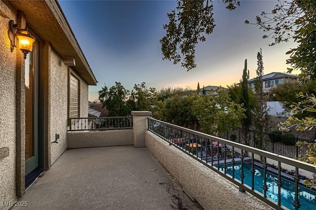 view of balcony at dusk