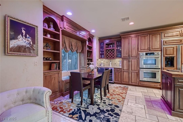 dining area with wine cooler and indoor bar