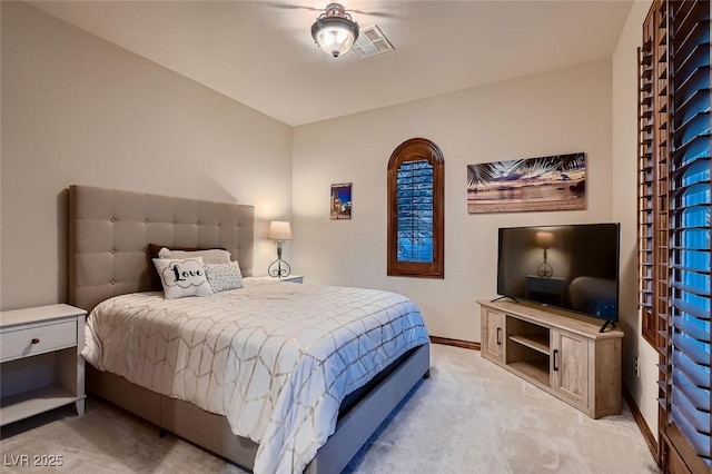 bedroom featuring light colored carpet