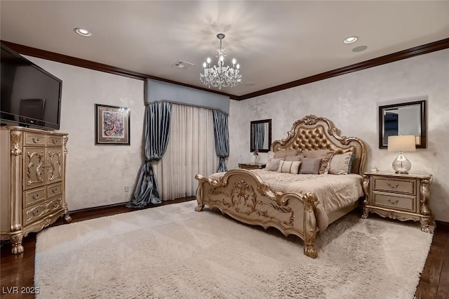 bedroom with dark hardwood / wood-style flooring, ornamental molding, and a chandelier