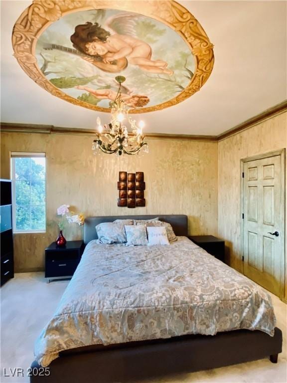 carpeted bedroom featuring crown molding and a chandelier