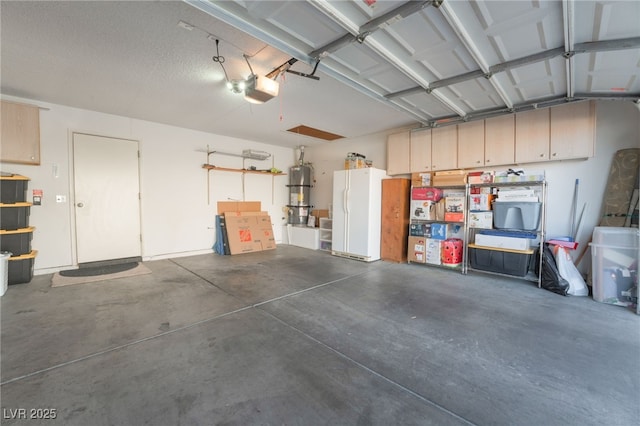 garage featuring a garage door opener and white fridge