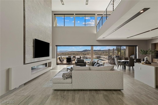 living room with a high ceiling