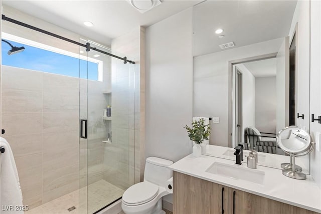 full bath with recessed lighting, visible vents, toilet, vanity, and a shower stall