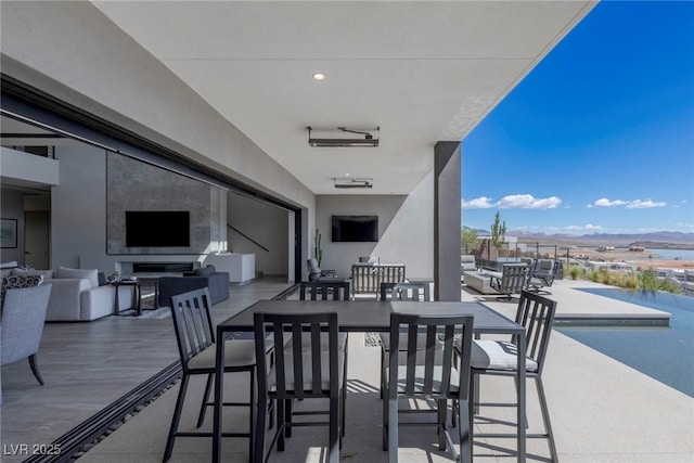 view of patio featuring outdoor lounge area and an outdoor pool