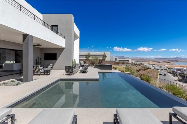 view of swimming pool featuring a fenced in pool, a residential view, a patio, and fence