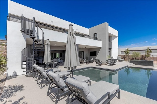 pool with stairs and a patio area