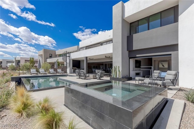 view of swimming pool featuring an in ground hot tub, a patio area, and a fenced in pool