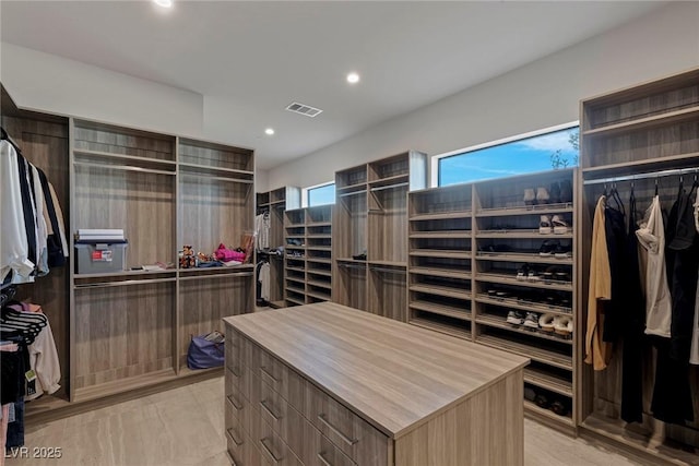 spacious closet featuring visible vents