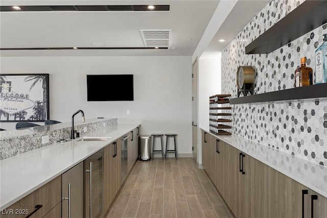 kitchen featuring wine cooler, modern cabinets, and open shelves