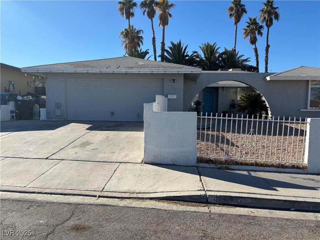 single story home featuring a garage