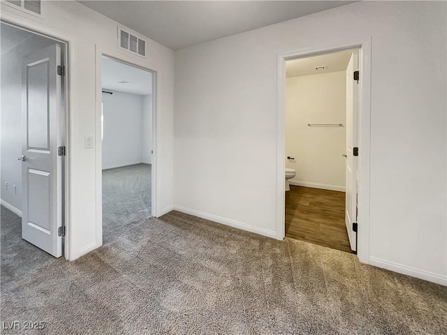 empty room featuring carpet flooring