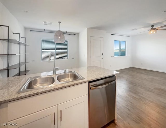 kitchen with dishwasher, white cabinetry, sink, hanging light fixtures, and ceiling fan